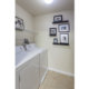 Laundry room with washer and dryer at Walnut Crossing apartment