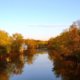 Fall foliage across water at Perkiomen Trail